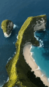 an aerial view of a cliff overlooking a beach