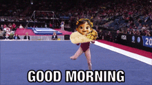 a picture of a girl doing a gymnastics routine with the words good morning below it