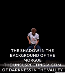a man is dancing on a stage with the words `` the shadow in the background of the morgue the unsuspecting victim of darkness in the