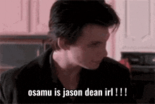 a close up of a man 's face with the words `` osamu is jason dean irl ! '' written on it .
