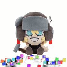 a stuffed toy with a hammer and a hat is smiling