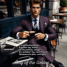 a man in a suit and tie is sitting at a table with a cup of coffee