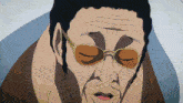 a close up of a man 's face with glasses on