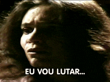 a close up of a woman 's face with eu vou lutar written in white