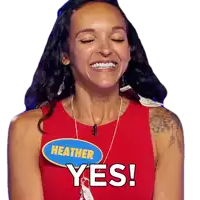 a woman with a name tag that says heather is smiling
