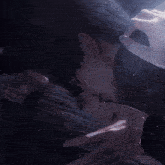 a man and a woman kissing in the dark