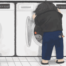 a person looking into a washing machine with a cat in it