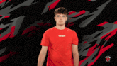 a man wearing a red shirt that says thing is taking a picture of himself