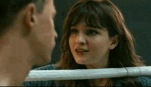 a man and a woman looking at each other