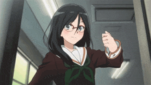 a girl wearing glasses is standing in a hallway