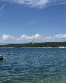 a body of water with a few buoys floating in it