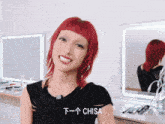 a woman with red hair is smiling in front of a mirror with the name chisa written on the bottom