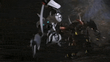 a group of people are standing in a dark room with smoke coming out of their mouths .