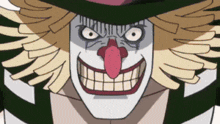 a close up of a clown 's face with a big smile