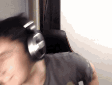 a person wearing headphones with the letter g on it