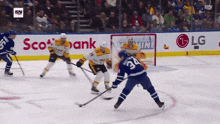 a hockey game is being played in front of an lg ad