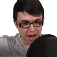 a man wearing glasses and a grey shirt is looking at something