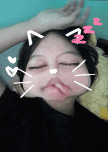 a girl is making a cat face with hearts and zzz written on it