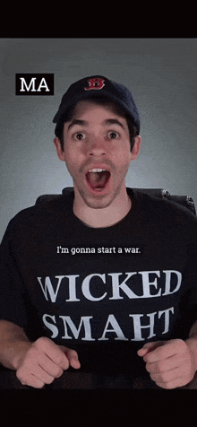 a man wearing a wicked smart t-shirt and a hat
