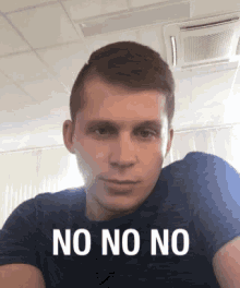 a man is wearing a shirt that says no on no