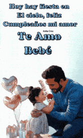 a man is kneeling down with a little girl in his arms and the words hoy hay fiesta en el cielo feliz