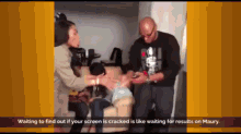 a group of people sitting on a couch waiting to find out if their screen has been cracked