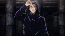 a man in a black hoodie with a purple stripe on the sleeves is standing in a dark room