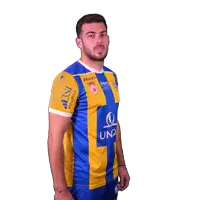 a man is wearing a blue and yellow shirt with the word una on it