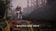 a pixelated image of two people standing on a bridge with the words paulina and neve below them .