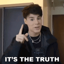 a young man is pointing up with the words it 's the truth below him .