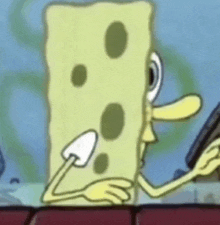 a close up of a cartoon character , spongebob squarepants , holding a piece of cheese .