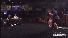a wrestling show called the slammys is being shown on a screen