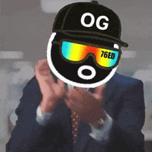 a man in a suit and tie is wearing a hat that says og 76ed