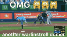 a blue jays baseball game is being played in front of a canadian ad