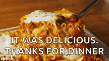 a slice of lasagna is being taken out of a pan with the words " it was delicious thanks for dinner " below it