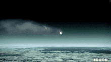 a picture of a cloudy sky with a dollar sign in the upper right corner