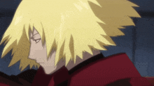 a close up of a person with yellow hair and a red jacket