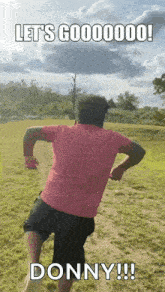 a man in a pink shirt is running in a field with the words let 's gooooooo donny !!
