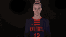 a woman in an orange and black jersey with the letter t on the front