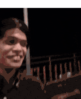 a man kissing a woman on the forehead in a blurry photo