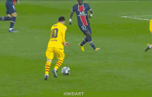 a blurry picture of a soccer field with the words hmdart on the bottom right