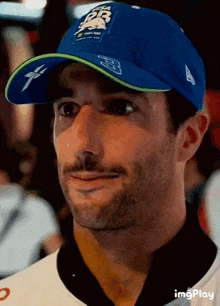a close up of a man wearing a blue hat that says dr