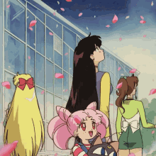 a group of anime girls are standing in front of a building with petals falling from the sky