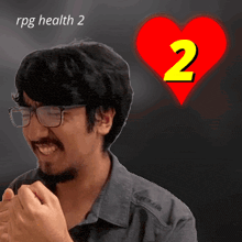 a man with glasses and a red heart with the number 2