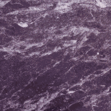 a purple marble counter top with a gray item on it that has the letter c on it