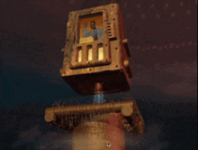 a computer screen shows a robot with a picture of a man on the screen