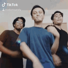 a group of young men are dancing together in a tik tok video