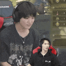 a man wearing headphones and a shirt that says gnub on it