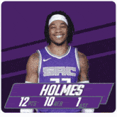 a man wearing a purple basketball jersey with sac on it
