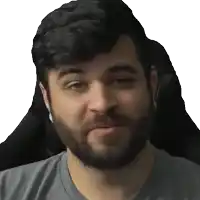 a man with a beard is wearing headphones and looking at the camera